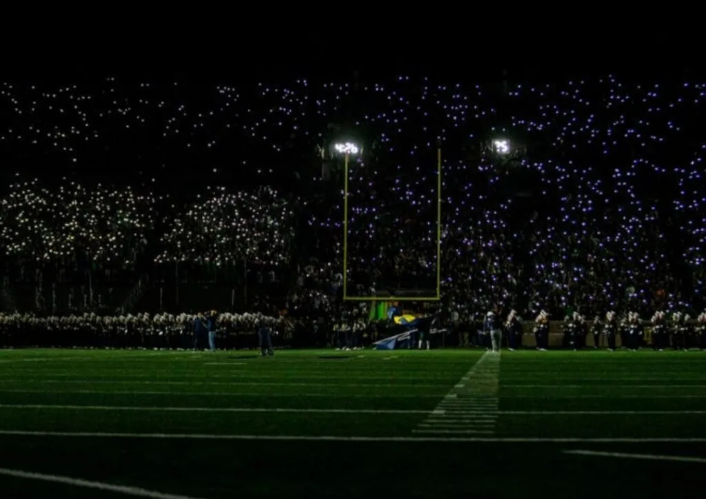 Young football players celebrating during a professional stadium match in 2026