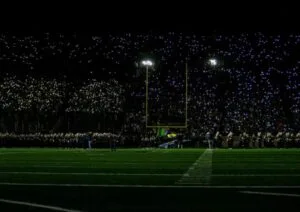 Young football players celebrating during a professional stadium match in 2026