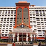 Kerala High Court building in Kochi and poster of The Kerala Story film