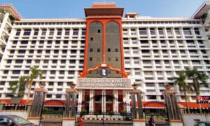 Kerala High Court building in Kochi and poster of The Kerala Story film