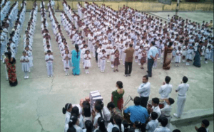 Indian school students standing in lines during morning assembly