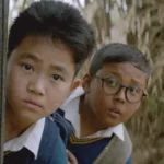 Boong movie scene showing a young boy searching for his missing father in Manipur