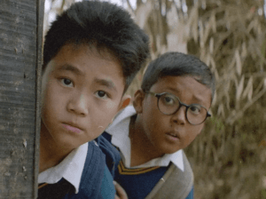 Boong movie scene showing a young boy searching for his missing father in Manipur