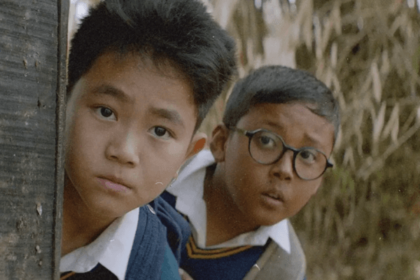 Boong movie scene showing a young boy searching for his missing father in Manipur