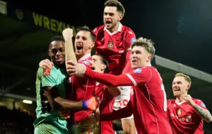 Wrexham AFC players celebrating a goal during FA Cup match