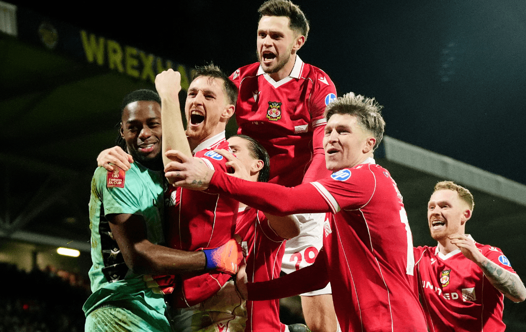 Wrexham AFC players celebrating a goal during FA Cup match